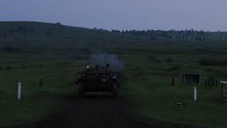 An infantry fighting vehicle (bmp-2) firing at night