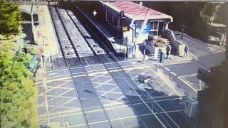 Speeding cyclist crashes into barriers at a level crossing as train approaches Ireland