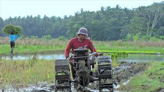 Tractor Turning Dirt Over Beside The Old Corn Field