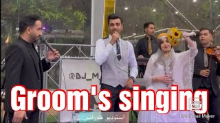 The groom's singing on her wedding night. داماد شب عروسیش برای برادرش خوند.