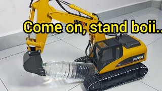 Excavator Showing Skills, Standing a Bottle.