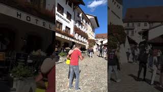 Swiss Alphorn performance at Gruyères town center, Switzerland