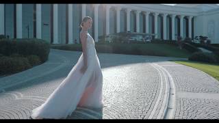 Carina Delicate wedding dress with thin straps and a soft skirt with a train