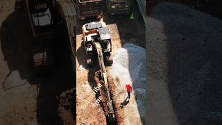 Excavator at Work: Sewerage Line Installation & Truck Loading"