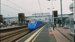 LUMO 803002 heading non-stop through Peterborough to London King's Cross.