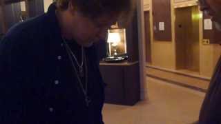 Eddie Money signing several autographs for us - TopSignatures.com