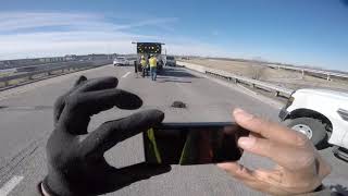 MoDOT maintenance workers filling potholes in the center lane of highway - very intense