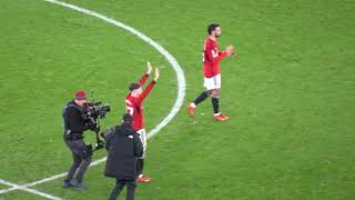 Manchester United players applaud fans after 2023 Boxing Day comeback victory against Aston Villa