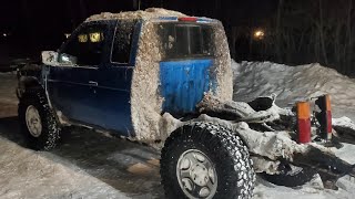 Nissan Hardbody D21 in the river and snow