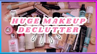 HUGE MAKEUP DECLUTTER 2022! | FOUNDATIONS, SETTING SPRAYS & MORE! | JEBeauty