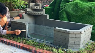 Design a compact glass tank in the corner of the yard