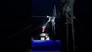 Person performs a dangerous circus trick!