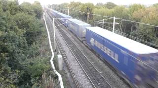 Freight train passing under Moore Lane bridge