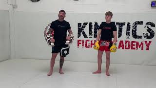 Muay Thai pad combo jab - cross - elbow - knee - body kick