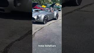 Kit cobra pulling into car show with loud exhaust