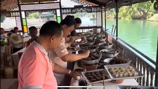 Enjoying a meal on Amore Cruise in  Loboc River, Bohol, Philippines