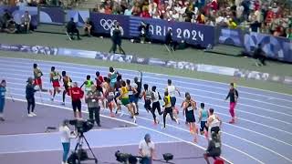 Cameraman in the middle of the track during the 5000 meters at the 2024 Olympics