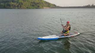 Kneeling on eSUP by SUP motor