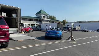 Lime Rock Park paddock featuring race cars and teams to tackle the days races.