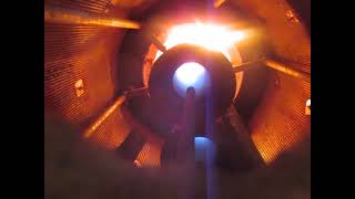 Looking up through a sight port of a process heater burner which has internal premix venturis