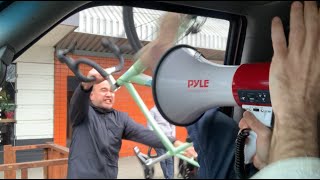 cyclist flips out, smashes car window