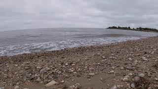 Calming Waves and Sailboats in the Distance.