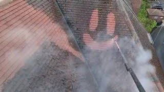 Guy Draws a Smiley Face on Roof Tiles