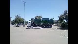 WM garbage truck arriving to lunch break