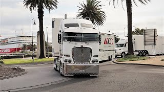 Massive race car transporters take on tight Melbourne roundabout