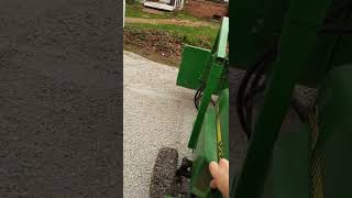 John Deere 318 Front end loader in action