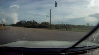 Parents walking their child across a four lane highway