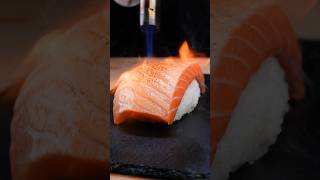 Giant grilled salmon nigiri