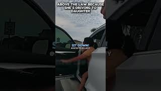 Above the law because she's driving to daughter. #shorts #police #cops #truecrime #viral