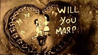 Ebook: How to plan a destination marriage proposal; Engagement idea - Sand Animation