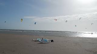 Camber Sands, kite surfers riding the waves, October 2023