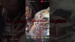 King Von opening up a gift from a fan and it’s a pillow with his grandmother picture on it