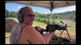 Momma shoots a m249 belt-fed machine gun.