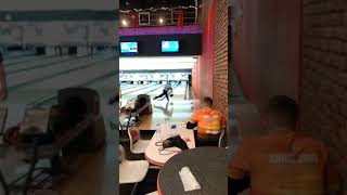 9 years old playing bowling with two hands