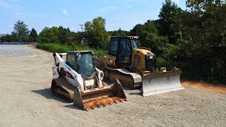 Spreading a few THOUSAND TONS of stone with a bulldozer.