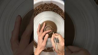 Trimming a foot ring into the bottom of a little stoneware bowl. #pottery #ceramic #potteryskills