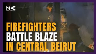 Firefighters battle extinguish blaze caused by Israeli strike on Beirut's Mar Elias district