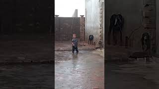 Baby enjoying in Rain,