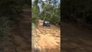 Mud over the bumpers on the black jeep