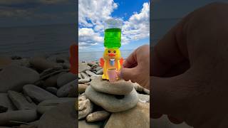 Green water fruit juice dispenser at the beach by mini duck #shorts