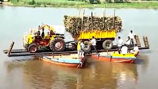 Hindustan Tractor & trolley transporting in boat⛵Sugarcane loaded transporting boat ಕಬ್ಬಿನ ಗಾಡಿ