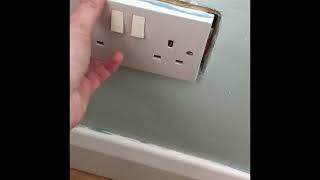 Loose plug. dry lining socket back box cut too big. repair plaster board (dry wall) plug socket