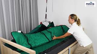 Immedia 4WayGlide Mattress turning user on side using Molift Ceiling Hoist - Novis Healthcare®