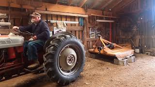 1953 Ford Jubilee & 2006 John Deere 4115 Tractors Moving 10-foot Logs 4-5-2024.