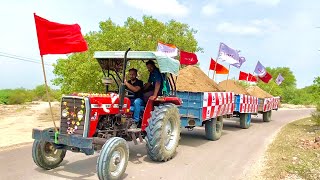 Massey Ferguson 1035 Di Tractor smoothly pulling 3 trolleys loaded with soil