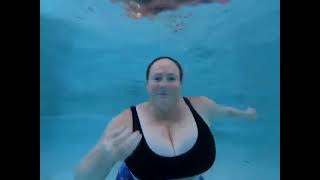 women talking underwater